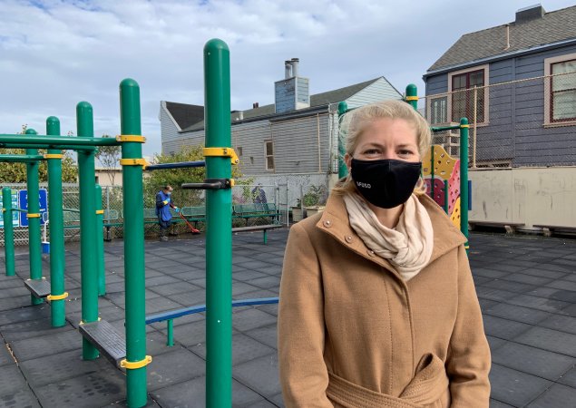 Cadi Poile, director of custodial services at SFUSD, stands wearing a face mask at an SFUSD school playground
