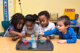 young children doing science experiment