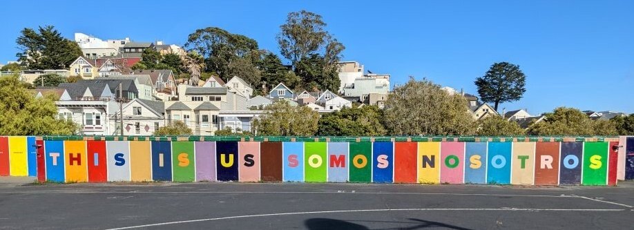 Mural at the school that says "This is us Somos Sonsotros"