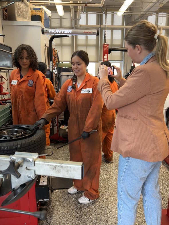 Female student in auto shop program