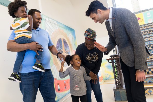 Family is greeted at a school