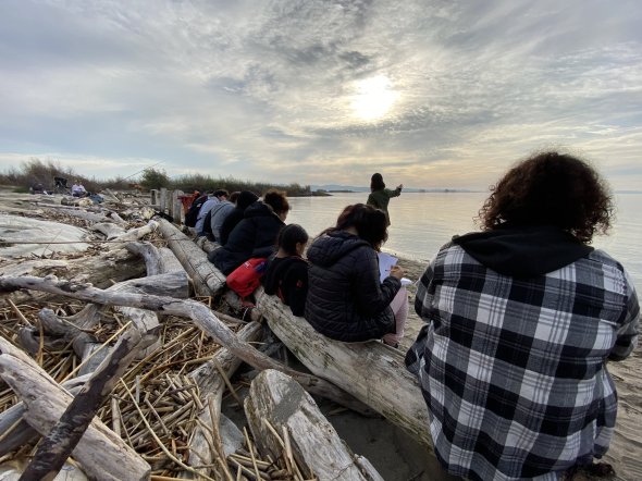 WALC students take notes on a fieldwork trip.