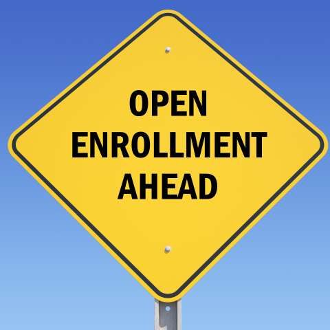 Open Enrollment Ahead sign in yellow 