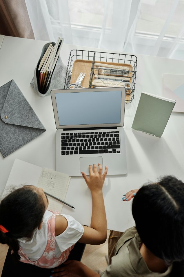 parent and student in front of computer