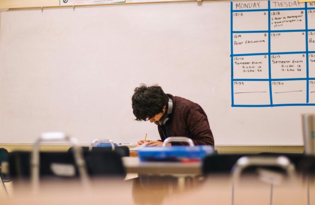 student doing work in classroom